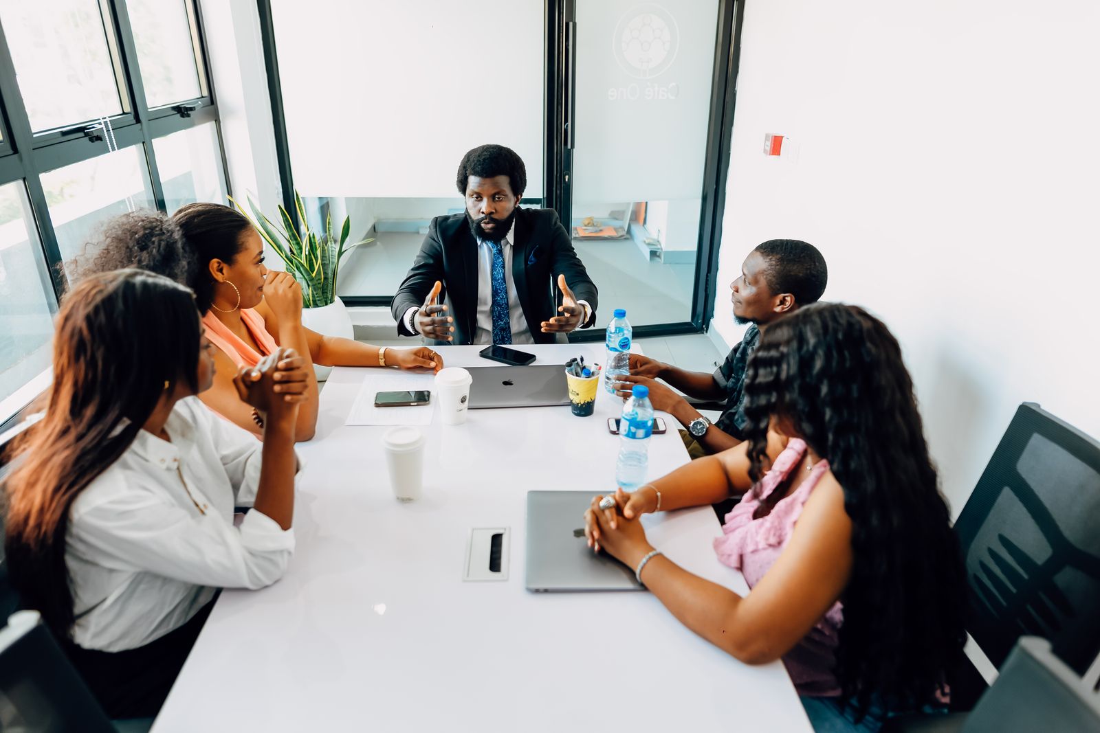 African team of entrepreneurs and investors in a boardroom meeting
